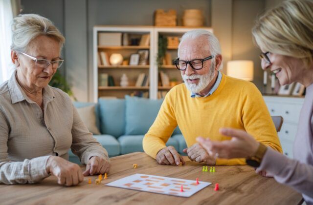 A group of seniors playing a board game together.